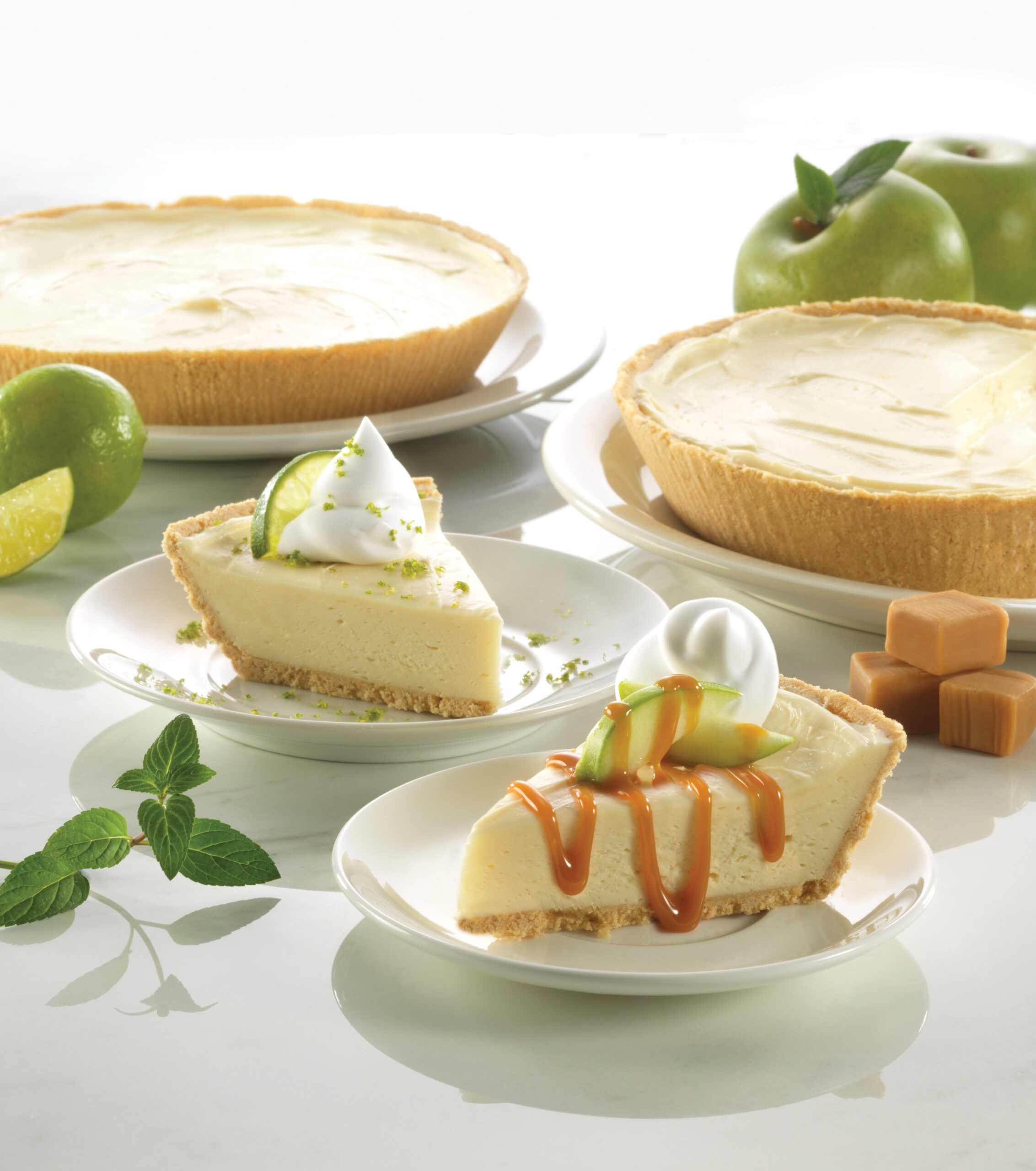 A table displaying a whole pie, a single slice of pie, and a slice of apple pie arranged neatly.