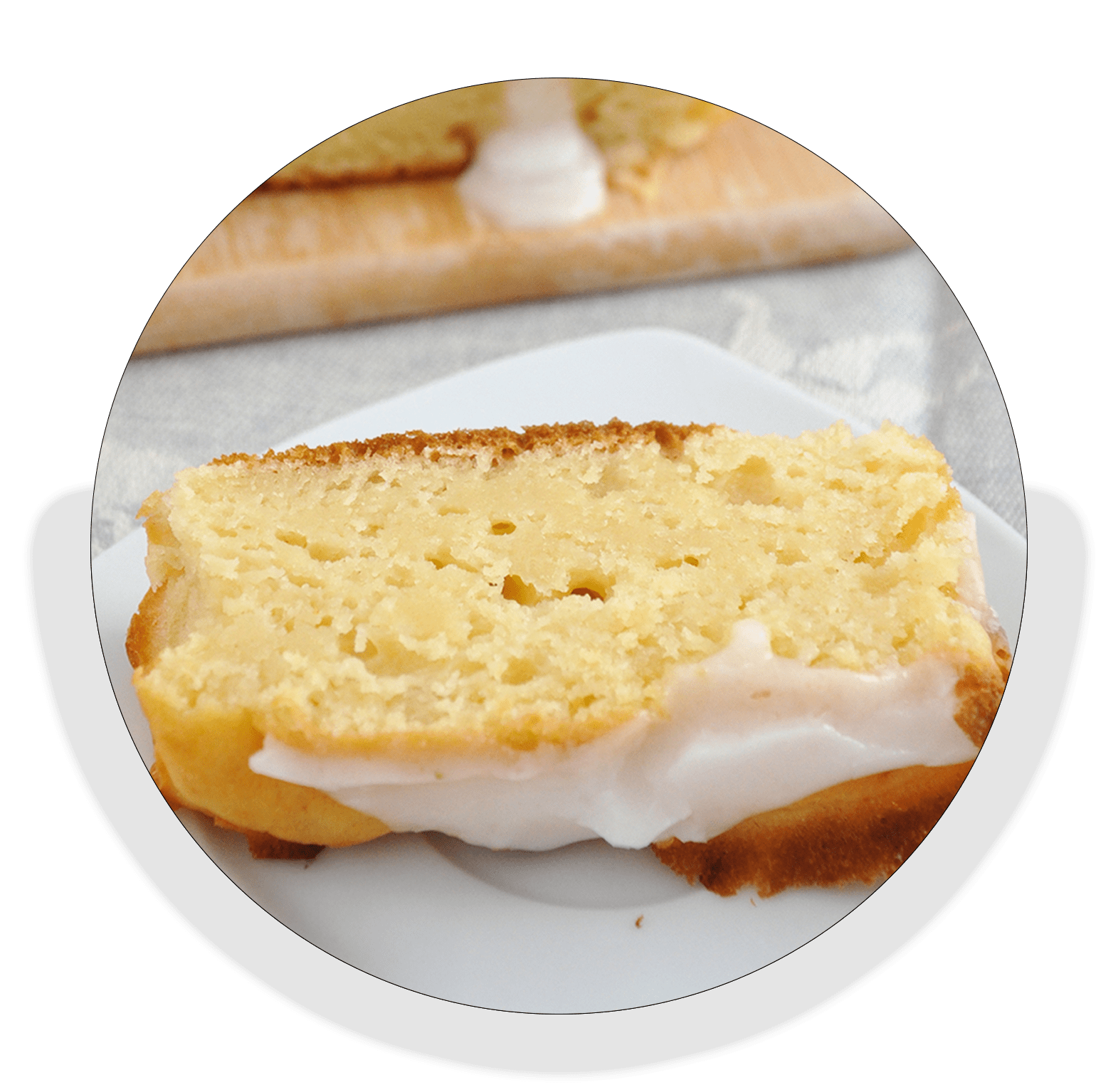 A slice of cake elegantly presented on a white plate, showcasing its layers and frosting.